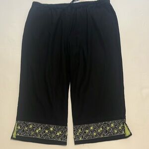 Black cropped pants lime green squares showing through a black & white design